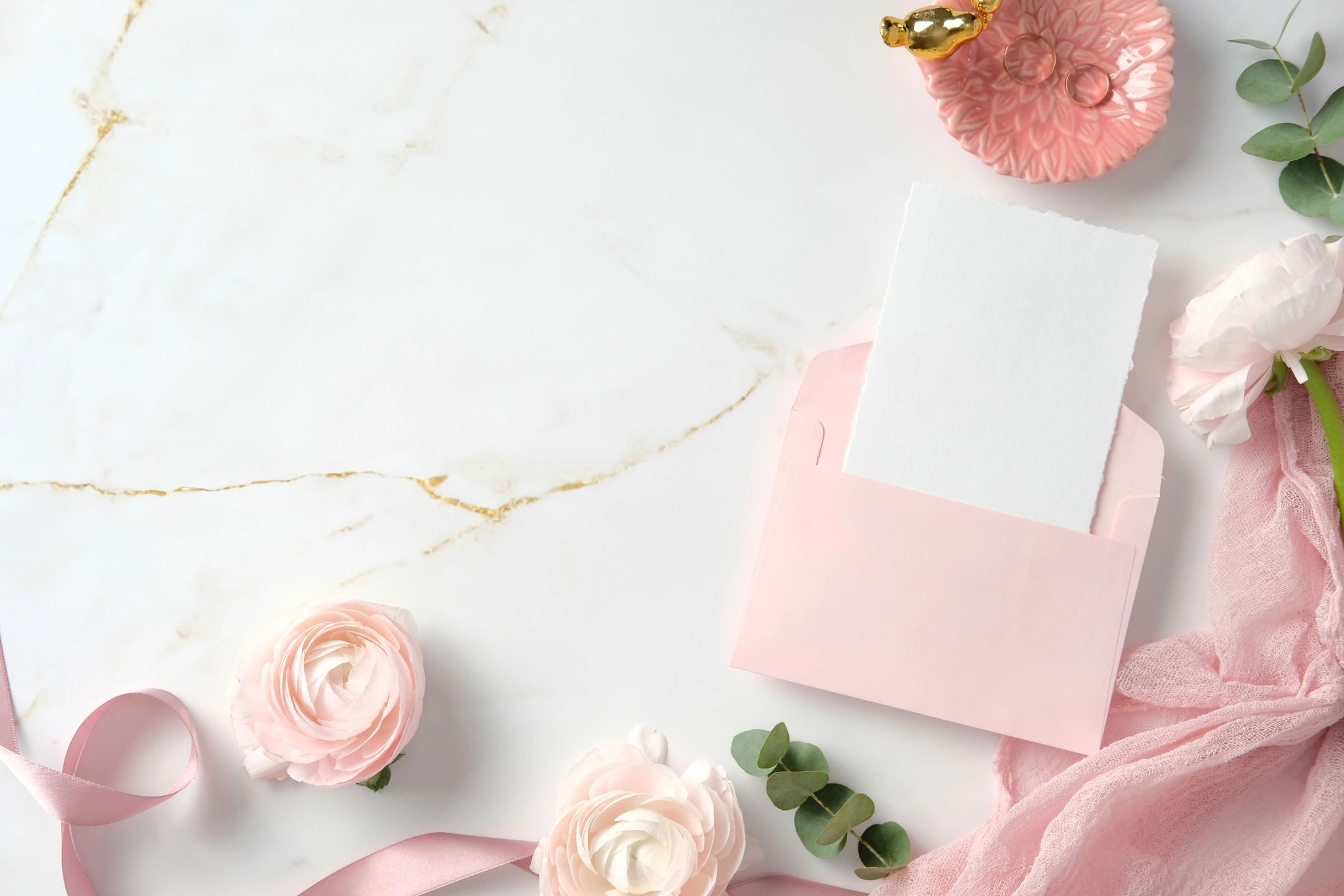 Wedding stationery flat lay with flowers